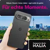 A hand holding a black smartphone with a cityscape in the background. Produktbild-Vorschau