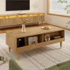 A living room scene featuring a coffee table with items on it and a media console in the background. Produktbild-Vorschau