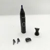 A black Philips nose trimmer with several attachments is displayed on a white surface. Podgląd zdjęcia produktu