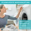 A woman is interacting with a washing machine, with laundry nearby. Icons and text suggest washing instructions. Produktbild-Vorschau