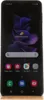 A Samsung Galaxy Z Flip3 5G smartphone is displayed in its open state, showing the home screen with various app icons and a search bar. Náhľad obrázku produktu