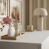 A close-up of a white dresser top with decorative items. Produktbild-Vorschau