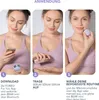 A woman demonstrating how to use a FOREO BEAR mini device. Produktbild-Vorschau