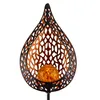 A close-up studio shot of a decorative solar garden light with a flame-shaped metal frame and a crackled glass orb. Anteprima dell’immagine prodotto