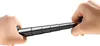 Two hands holding a black and silver telescopic selfie stick. Náhled obrázku produktu