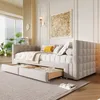 A bedroom or living room setting with a daybed and pull-out drawers. Náhľad obrázku produktu
