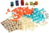 A collection of colorful plastic pieces for a marble run toy, including tubes, connectors, balls, and stickers, arranged on a white background. Anteprima dell’immagine prodotto