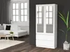 A white cabinet with glass doors stands in a modern living room with a white sofa and coffee table. Produktbild-Vorschau