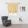 A room with a window, a chair, and a small table. Voir les images du produit