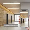 A hallway with wooden walls and modern LED ceiling lights, viewed through a smartphone screen. Anteprima dell’immagine prodotto