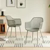 Two gray chairs are placed on a rug in a room. Náhled obrázku produktu