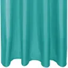 A close-up view of a turquoise curtain. Voir les images du produit