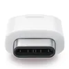 A close-up, studio shot of a white USB-C to Micro USB adapter. Podgląd zdjęcia produktu