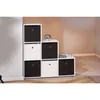 A modular storage unit with black and white fabric bins. Produktbild-Vorschau