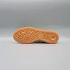 The bottom view of a green Adidas Handball Spezial shoe. Produktbild-Vorschau