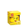 A yellow LEGO storage head in its packaging. Produktbild-Vorschau
