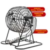 A black metal bingo cage with white bingo balls inside and on the base, with red text overlays highlighting features. Produktbild-Vorschau