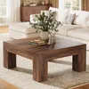 A living room scene with a coffee table and sofa. Voir les images du produit