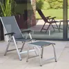 An outdoor patio scene with a chair and footrest. Produktbild-Vorschau