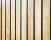 A close-up view of wooden slats with black dividers. Produktbild-Vorschau
