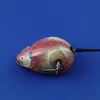 A tin toy mouse on a blue background. Produktbild-Vorschau