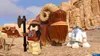 A scene from a video game with LEGO characters and creatures in a desert environment. Produktbild-Vorschau