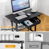 A collage of images showing a height-adjustable desk with a computer setup, a close-up of the desk's stability feature, and a comparison of stability mechanisms. Anteprima dell’immagine prodotto