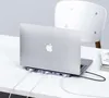 A laptop docking station connected to a laptop on a desk. Produktbild-Vorschau