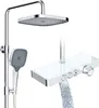 A modern shower fixture with a rain showerhead, handheld shower, and a thermostatic control panel with a waterfall spout. Podgląd zdjęcia produktu