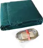 A folded green tarp and a package of accessories. Produktbild-Vorschau