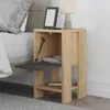 A bedside table next to a bed, with a book and lamp on top. Podgląd zdjęcia produktu
