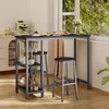 A bar table and two bar stools are set up in a kitchen or dining area, with a window showing greenery outside. Náhľad obrázku produktu
