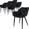 A set of six black velvet dining chairs with tufted backs and black legs are arranged on a white background. One chair is in the foreground, angled towards the viewer, while the other five are in the background, clustered together. Produktbild-Vorschau