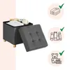 A storage ottoman with its lid open, showing it can store items like books, toys, and folded clothes. Icons with checkmarks indicate suitable items for storage. Náhled obrázku produktu