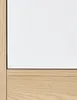 A close-up view of the corner of a wardrobe, showing the transition between a white door and a wooden base. Anteprima dell’immagine prodotto