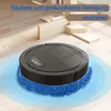 A black robot vacuum cleaner with a blue mop pad is cleaning a wooden floor. There are wooden blocks in the background. Produktbild-Vorschau