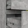 A close-up view of two open drawers of a gray, concrete-look dresser, showing the metal drawer slides. Produktbild-Vorschau