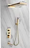 A gold-colored shower system mounted on a marble-patterned wall, with dimensions indicated by lines and numbers. Podgląd zdjęcia produktu