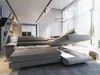 A modern living room with a sectional sofa, stairs, and kitchen area. Produktbild-Vorschau