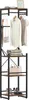A freestanding coat rack with shelves, displaying clothing, bags, and shoes. Náhled obrázku produktu