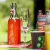 A table set for a party with drinks and cups. Produktbild-Vorschau