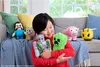 A young boy is holding several Minecraft plush toys on a couch. Podgląd zdjęcia produktu