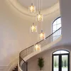 A grand staircase with a modern chandelier. Produktbild-Vorschau