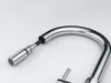 A close-up shot of a chrome faucet with an extendable shower head. Podgląd zdjęcia produktu