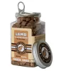 A jar of freeze-dried lamb treats for cats and dogs, with the lid placed next to it. Podgląd zdjęcia produktu