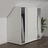 A white sliding door wardrobe is shown in an attic room with a slanted ceiling. Produktbild-Vorschau