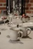 A table setting with mugs, glasses, and decorative elements. Náhľad obrázku produktu