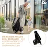 A woman is walking with a toddler, holding a folded stroller. Podgląd zdjęcia produktu
