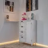 A corner of a room with a white cabinet and decorative items. Náhled obrázku produktu