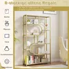 A gold-colored, multi-tiered bookshelf with decorative geometric elements, filled with various items. The left side of the image features icons and text describing potential uses for the shelves. Produktbild-Vorschau